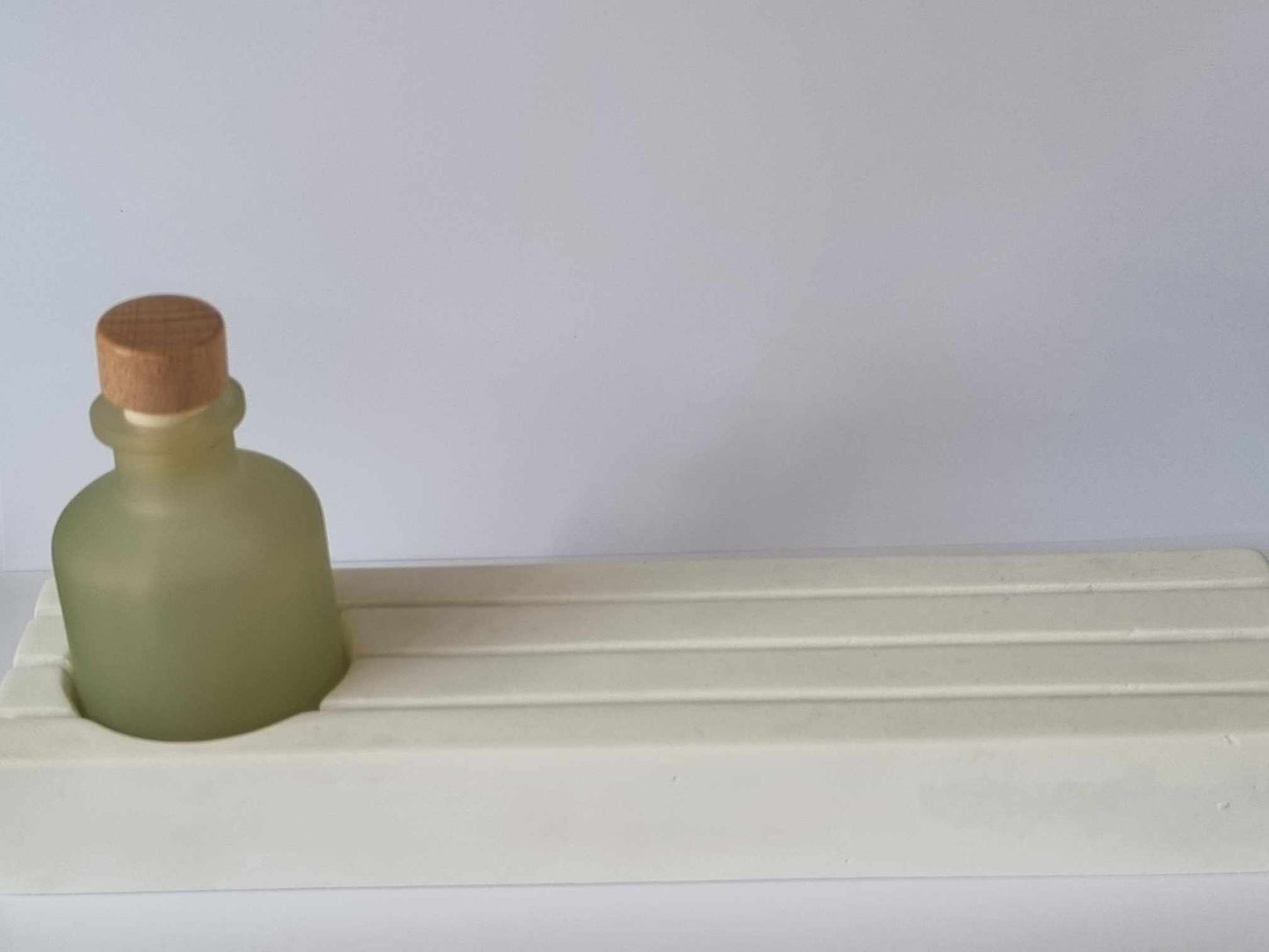 terrazzo kaarthouder met licht groen flesje